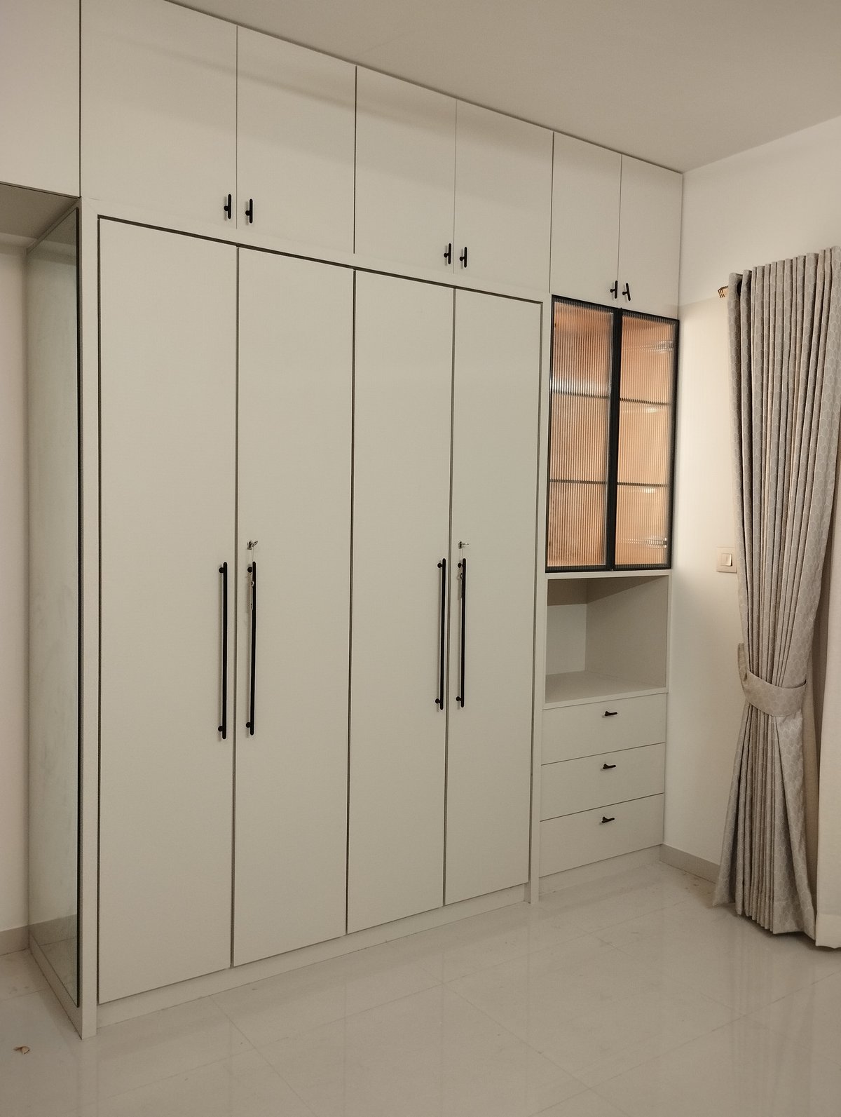 White wardrobe with glass cabinet